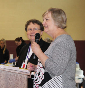 Carol Braden-Clarke, right, director of Development for the Ursuline Sisters, talks about some upcoming events for the alumnae to support, as Sister Amelia Stenger looks on.