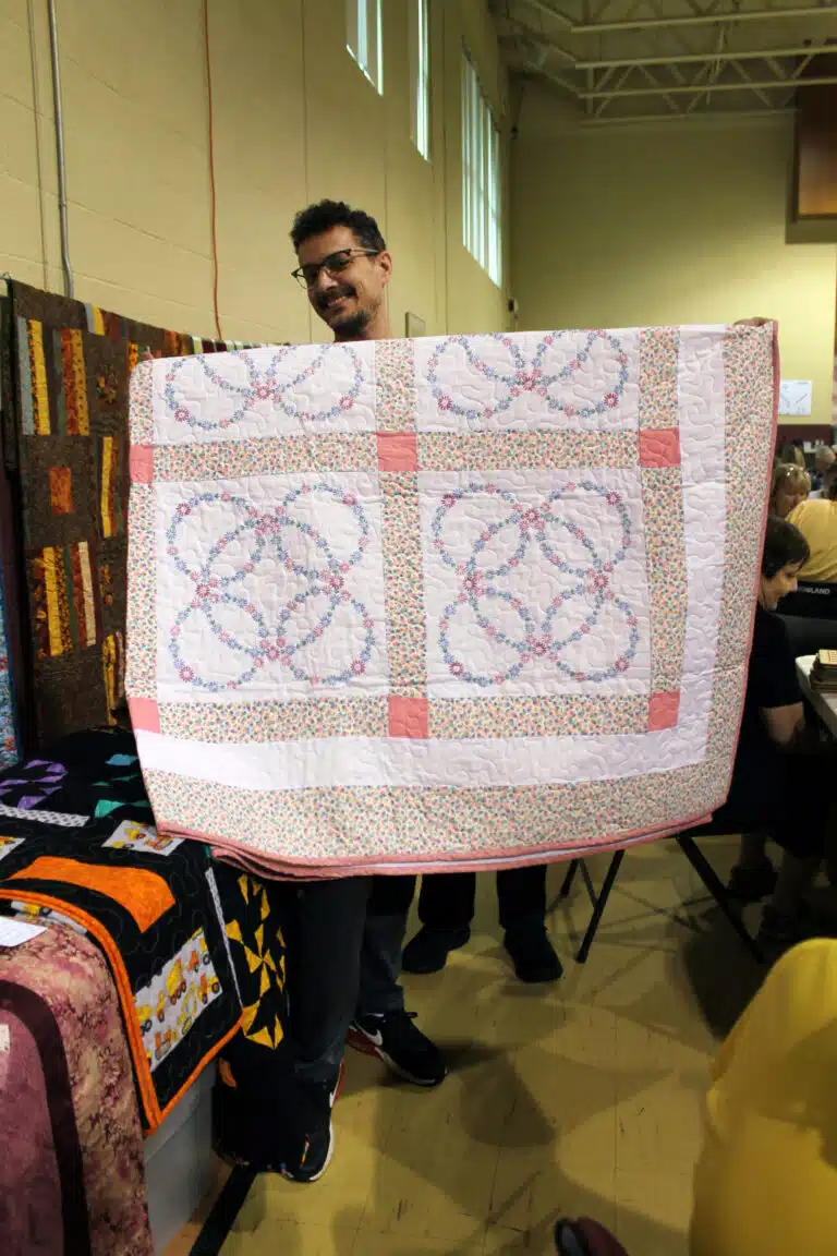Daniel Sanders of Owensboro took home the “Rings of Flowers” embroidered quilt after winning a bingo game. Daniel Sanders of Owensboro took home the “Rings of Flowers” embroidered quilt after winning a bingo game.