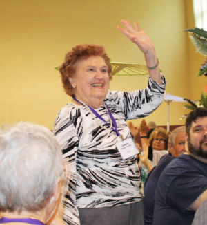 Louise Fowler Gaddie, class of 1945, waves to those applauding her as the most senior alumna at the reunion.