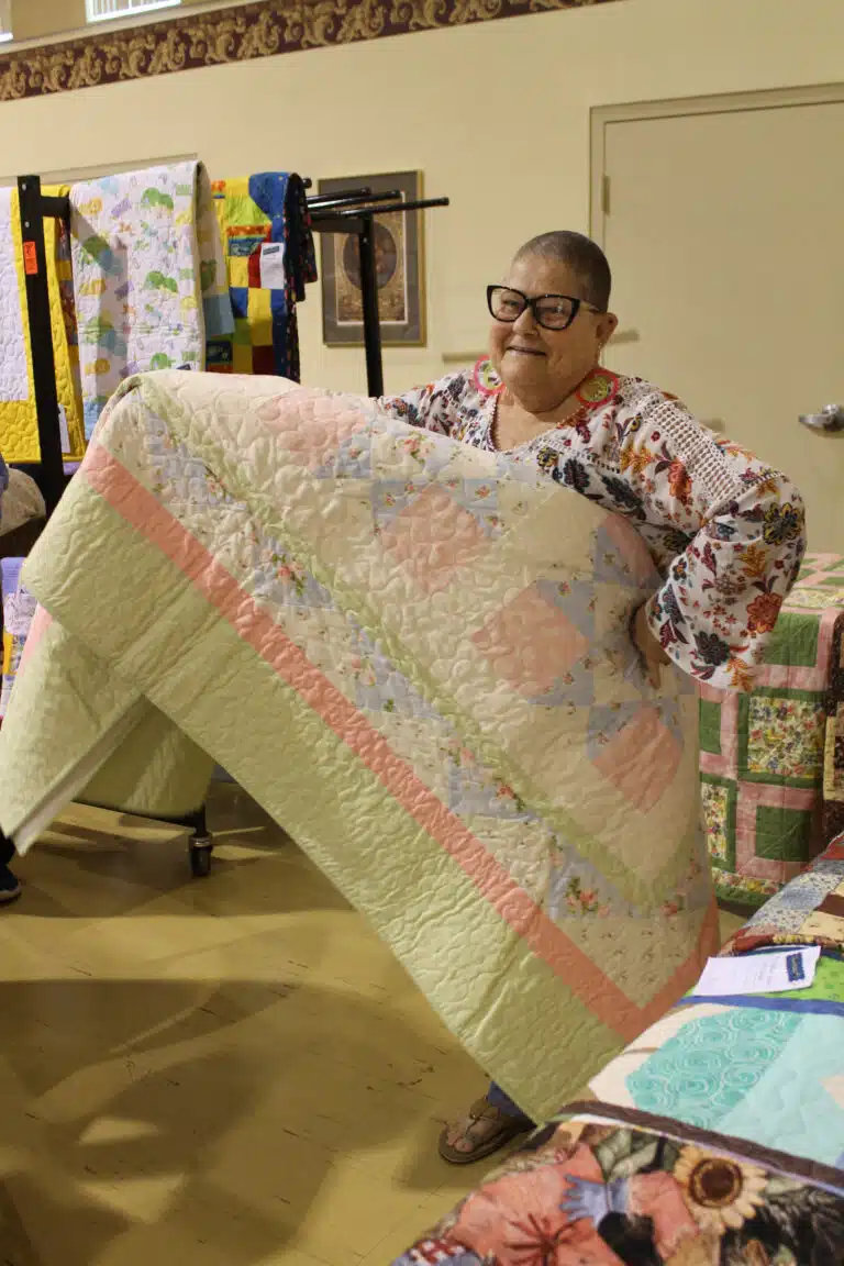 Anna Hardesty of Owensboro was tickled pink with her new “Pink and Pretty” quilt. It was pieced by Sally Fitzgerald, quilted by the late Sister Amelia Stenger, and bound by Sister Elaine Burke. Anna Hardesty of Owensboro was tickled pink with her new “Pink and Pretty” quilt. It was pieced by Sally Fitzgerald, quilted by the late Sister Amelia Stenger, and bound by Sister Elaine Burke.