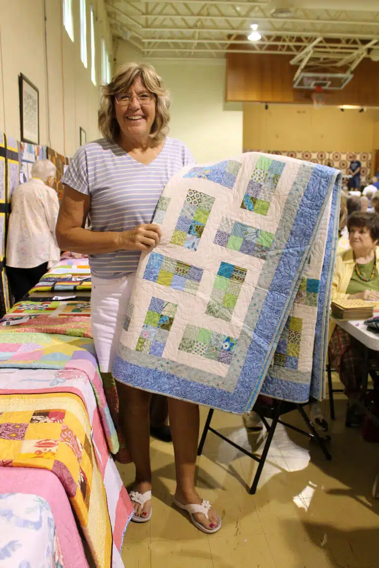 Jennifer Allen of Owensboro chose the “Bright Stars” quilt when she won game #15. Jennifer Allen of Owensboro chose the “Bright Stars” quilt when she won game #15.