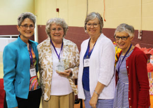 Judith Calhoun Ward, A60, second from left, poses with the Alumnae Association officers after winning the Maple Leaf Award. From left are Stephanie Warren, Ward, Paula Chandler Gray and Carolyn Drury McCarty