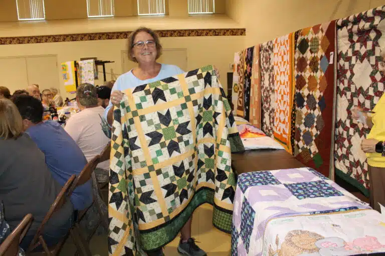 Lisa Clary of Owensboro was delighted to win the “All Year Long” quilt. Lisa Clary of Owensboro was delighted to win the “All Year Long” quilt.