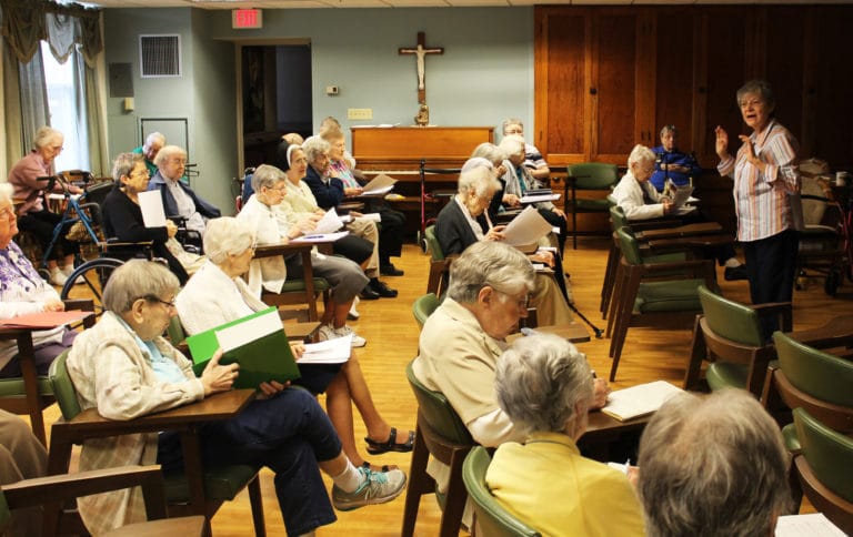 Sisters filled the St. Ursula Community Room to listen to Sister Cheryl and take notes.