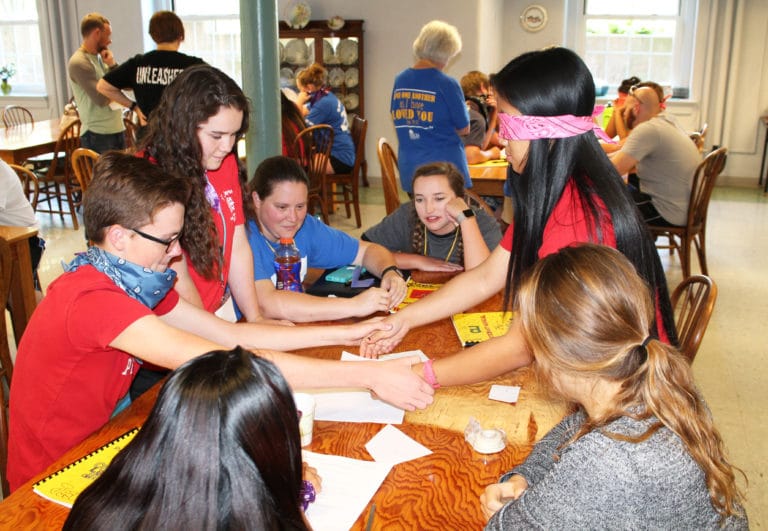 This teambuilding exercise from the 2017 Christian Leadership Institute shows Emily Linn in the center.