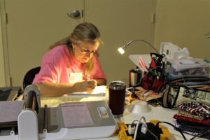 Judy Lancaster of Alvaton, Ky., used an extra lamp to make notes about her quilting project.
