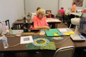Marilyn Collins of Albion, Ill., was making a Batik New York Beauty patterned quilt. She said she has been coming to Runaway for 24 years, and she used to bring her mother who is now deceased.