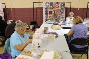 Barbara Spears of Paducah, Ky., and other quilters are busy with their projects.
