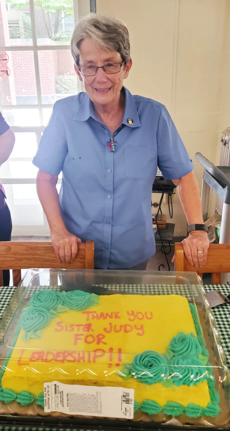 Sister Judith Nell Riney, councilor, enjoys her brightly colored cake. Sister Judith Nell continued to serve as director of library services at Brescia University during her time on the Council.
