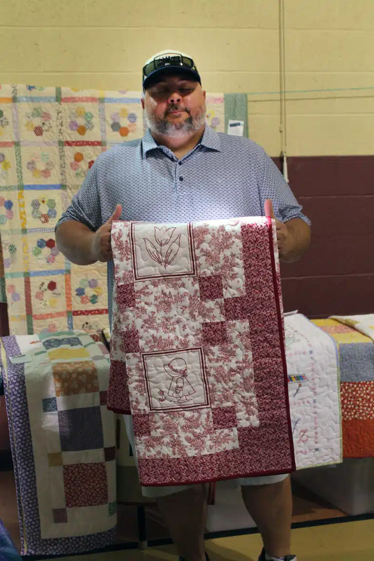 Joe Bickwerment of Owensboro got to take home the “Ruby Red” quilt after game 21. It was made by Sally Fitzgerald, quilted by the late Sister Amelia Stenger, and bound by Sister Elaine Burke. Joe Bickwerment of Owensboro got to take home the “Ruby Red” quilt after game 21. It was made by Sally Fitzgerald, quilted by the late Sister Amelia Stenger, and bound by Sister Elaine Burke.