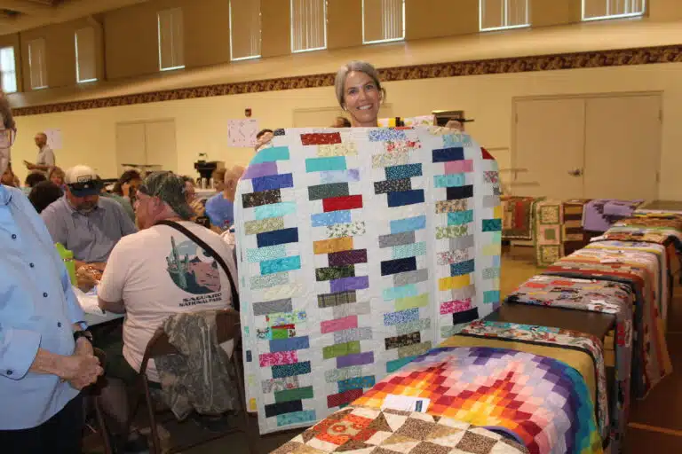 Tori Martin of Owensboro was drawn to the “Zigs and Zags” quilt after her bingo win. Tori Martin of Owensboro was drawn to the “Zigs and Zags” quilt after her bingo win.