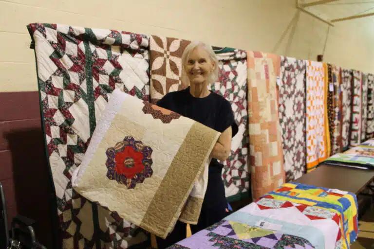 Mary Helen Nash of Owensboro smiled after winning this “Kaleidoscope” quilt. Mary Helen Nash of Owensboro smiled after winning this “Kaleidoscope” quilt.