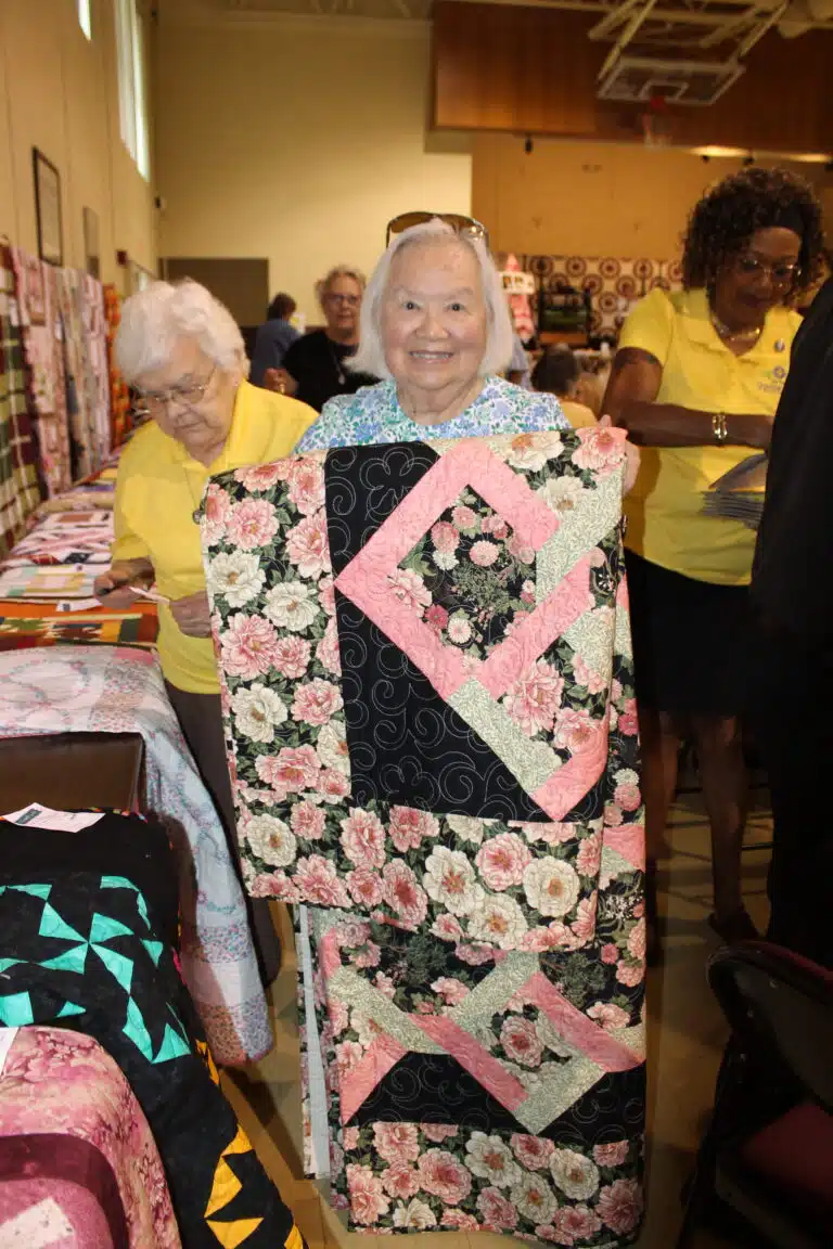June Cole of Bowling Green wanted the “Daisies and Dahlias” quilt after she won the third bingo game. June Cole of Bowling Green wanted the “Daisies and Dahlias” quilt after she won the third bingo game.