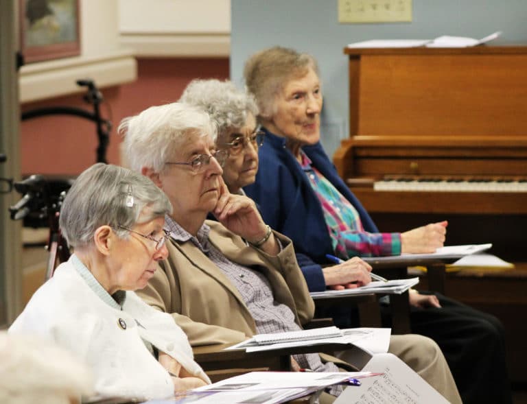 From left, Sister Amanda Rose Mahoney, Sister Eva Boone, Sister Mary Gerald Payne and Sister Marie Carol Cecil listen intently during the retreat.