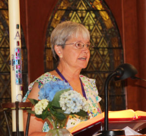 Kathryn Danhauer Wolsing, A69, reads from the Acts of the Apostles.