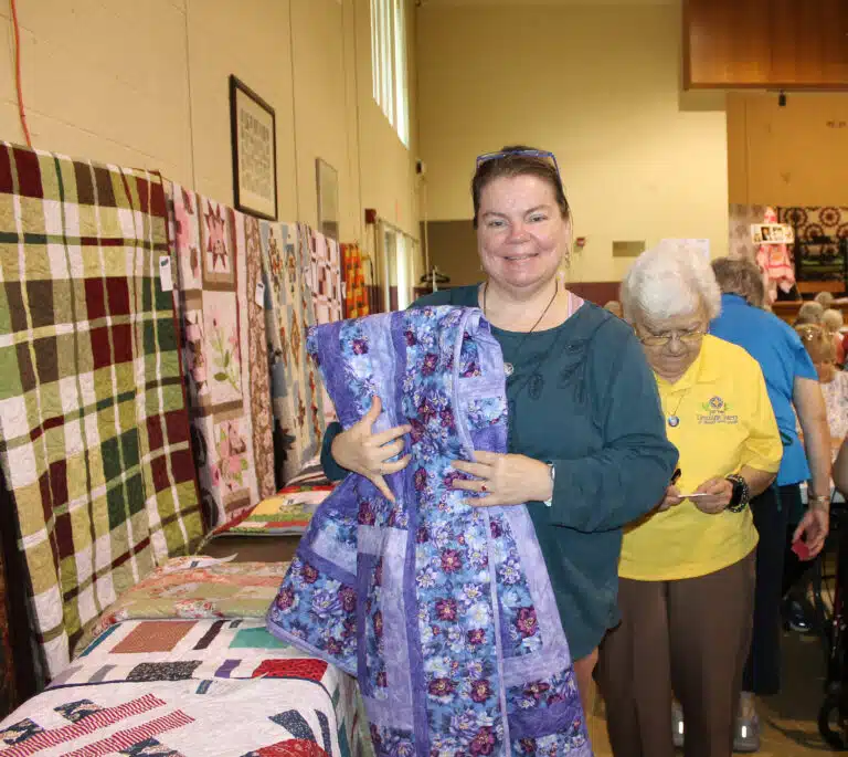 Sharon Tiahrt of Owensboro was lucky winner #5 who chose the “Purple Passion” quilt. She ended up winning another game toward the end of the event. Sharon Tiahrt of Owensboro was lucky winner #5 who chose the “Purple Passion” quilt. She ended up winning another game toward the end of the event.