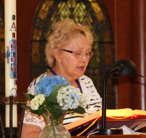 Patsy Onley Hock, A69, reads from the book of Revelation.