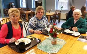 Ursuline Associates Carol Hill, left, and Susanne Reiss, center, join Sister Mary Matthias Ward, Center director, to start the day. The two associates come to Sister Cheryl’s retreat every year.