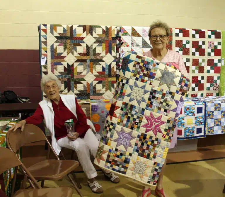 Carole Newsome chose Scrappy Stars. Sister Elaine Burke is seated next to her, she does binding on the quilts. Carole Newsome chose Scrappy Stars. Sister Elaine Burke is seated next to her, she does binding on the quilts.