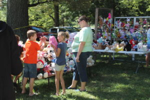 Children look for new friends at the Adopt A Pet stuffed animal booth.