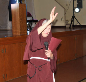 Saint Angela Merici (aka Sister Marietta Wethington) blesses everyone at the gala.