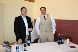 Tony Russell, left, and Dustin Mullins helped serve drinks at the gala. Dustin is married to director of Development Betsy Mullins, who organized the gala.