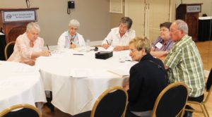 Theresa Butler, left, director of associates for the Ursulines of Louisville, leads the discussion on “The Call to Be an Ursuline Associate” with sisters and associates from several communities. Participants said it was important to be inviting to attract new associates.