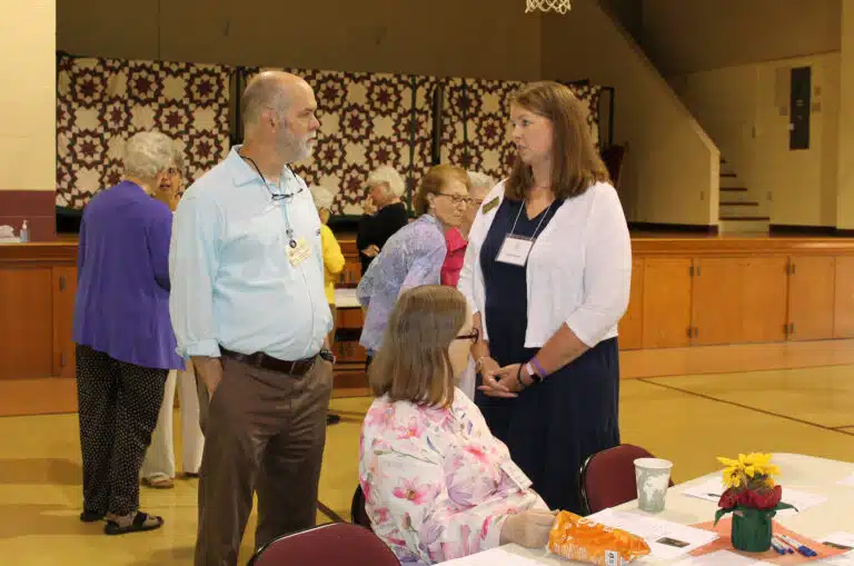 Associate Dan Heckel, who helped emcee the program, talks to Carrie Wentzel, an Associate with the Ursulines of Louisville. Carrie gave a short presentation about the Italy pilgrimage that she attended. Seated in front is Sister Rebecca White. Associate Dan Heckel, who helped emcee the program, talks to Carrie Wentzel, an Associate with the Ursulines of Louisville. Carrie gave a short presentation about the Italy pilgrimage that she attended. Seated in front is Sister Rebecca White.