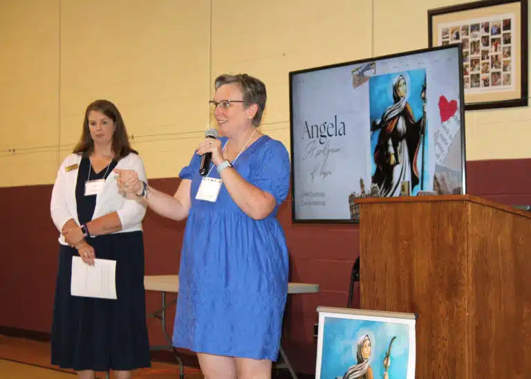 Jane Cruthirds, the keynote speaker, said she is using Angela as her model for the Jubilee Year of Hope. Standing to her left is Carrie Wentzel, who is also an Associate with the Louisville Ursulines. Jane Cruthirds, the keynote speaker, said she is using Angela as her model for the Jubilee Year of Hope. Standing to her left is Carrie Wentzel, who is also an Associate with the Louisville Ursulines.