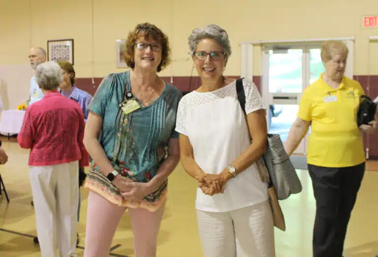 Associate Doreen Abbott, left, greets Associate Maryann Joyce at the start of the day. Abbott helped organize the event, including the food and drinks. Associate Doreen Abbott, left, greets Associate Maryann Joyce at the start of the day. Abbott helped organize the event, including the food and drinks.
