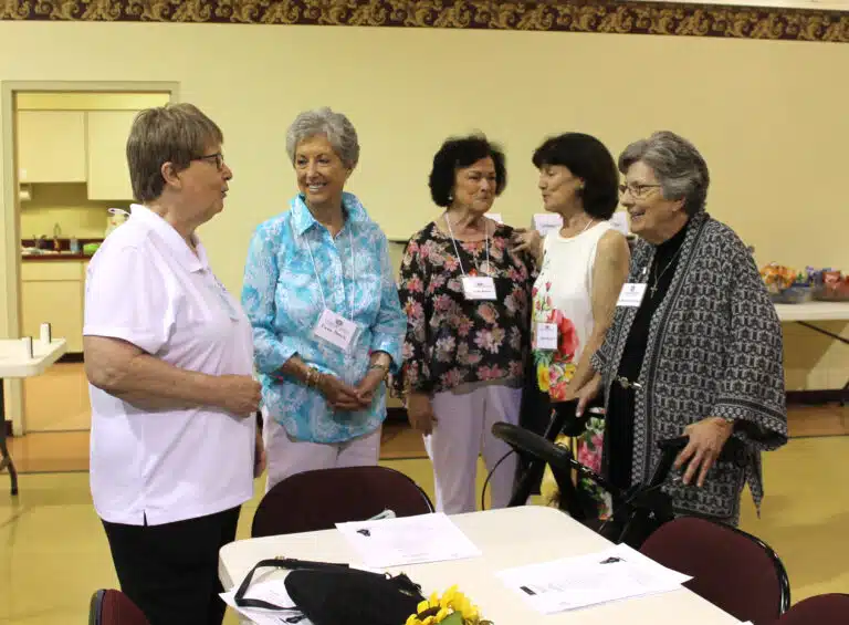 Left to right, Sister Amelia Stenger speaks with Associates Elaine Norcia, Linda Rocco, Carolyn Sue Cecil, and Sister Margaret Ann Aull. Left to right, Sister Amelia Stenger speaks with Associates Elaine Norcia, Linda Rocco, Carolyn Sue Cecil, and Sister Margaret Ann Aull.