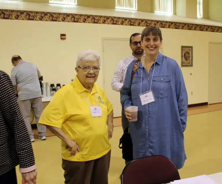 Sister Cecelia Joseph “C.J.” Olinger, left, greets Amy Fogle Stiff, who planned to make her Associate commitment that afternoon. Sister Cecelia Joseph “C.J.” Olinger, left, greets Amy Fogle Stiff, who planned to make her Associate commitment that afternoon.