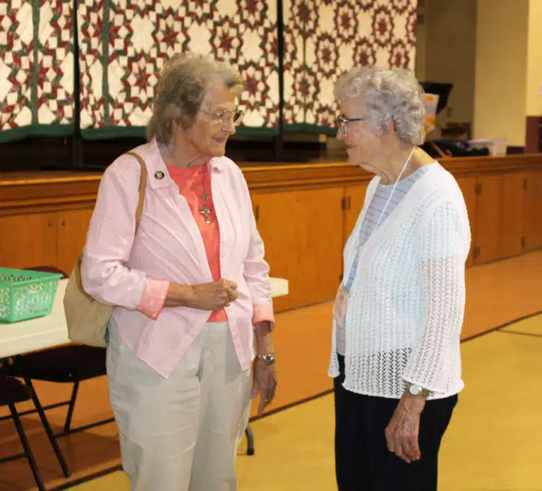 Associate Marilyn Terry of Eddyville, Ky., converses with Sister Ann Patrice Cecil in Maple Hall. Associate Marilyn Terry of Eddyville, Ky., converses with Sister Ann Patrice Cecil in Maple Hall.