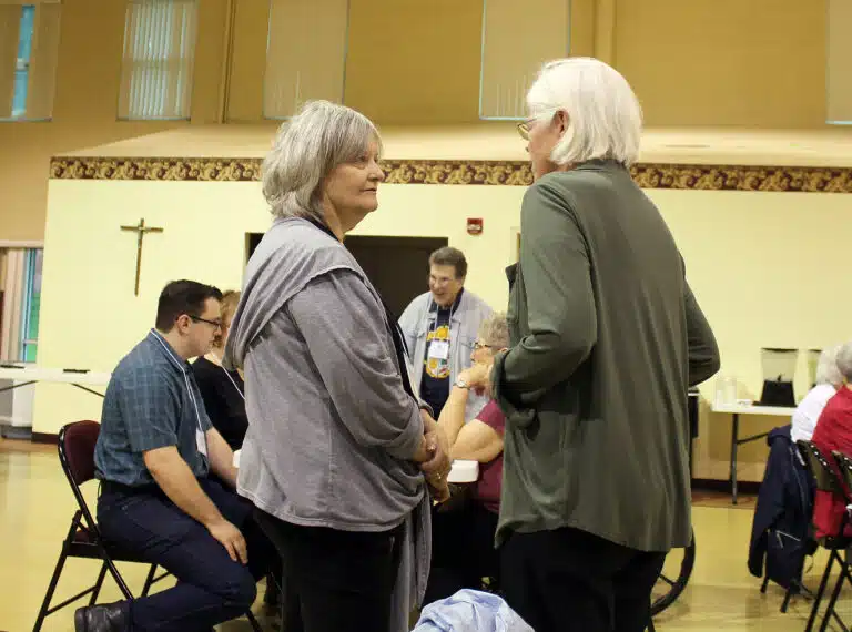 Associate Joyce York-Higginbotham of St. Louis, left, speaks with Sister Nancy Liddy the morning of the program. Associate Joyce York-Higginbotham of St. Louis, left, speaks with Sister Nancy Liddy the morning of the program.