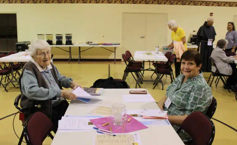 Sister Mary Matthias Ward, left, talks with her friend, Associate Bonnie Marks of Owensboro, before the program begins. Sister Mary Matthias Ward, left, talks with her friend, Associate Bonnie Marks of Owensboro, before the program begins.