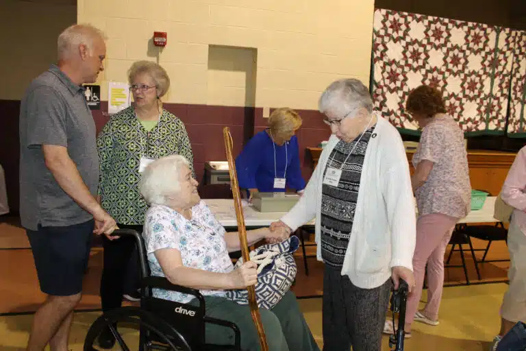 Sister Ruth Gehres, right, greets Associate Marian Bennett near the main entrance. Marian previously served as coordinator of Ursuline Partnerships. Marian’s son, Alex, left, who brought her, stopped to talk to Associate Suzanne Reiss. Sister Ruth Gehres, right, greets Associate Marian Bennett near the main entrance. Marian previously served as coordinator of Ursuline Partnerships. Marian’s son, Alex, left, who brought her, stopped to talk to Associate Suzanne Reiss.