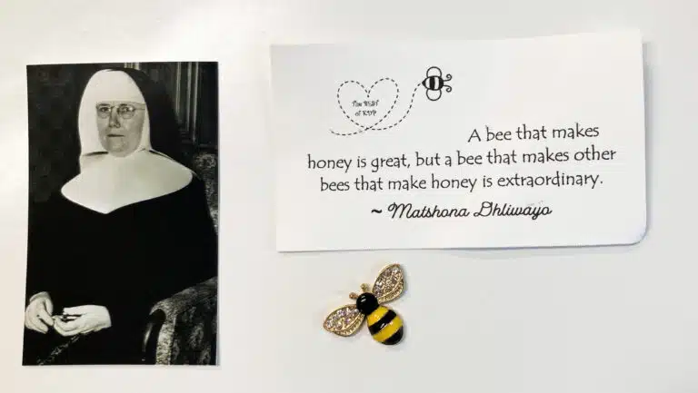 In small gift bags, Leanne Robertson provided the members of her sorority with this refurbished photo of Sister Mary Celeste McCue, a bee charm and this quote. Robertson brought leftover bags for the Sisters at Maple Mount. In small gift bags, Leanne Robertson provided the members of her sorority with this refurbished photo of Sister Mary Celeste McCue, a bee charm and this quote. Robertson brought leftover bags for the Sisters at Maple Mount.