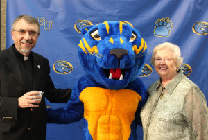 Sister Vivian and Father Larry Hostetter, who succeeded her as president of Brescia, joke around with Barney Bearcat before the festivities began.