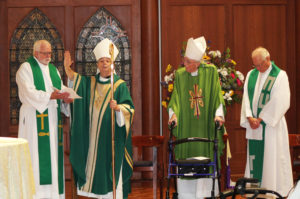 Father Ray Goetz, left, chaplain at Mount Saint Joseph, holds a prayer for the Most Rev. William Medley, bishop of the Diocese of Owensboro, to bless the new Leadership Council. Next to Bishop Medley is Bishop Emeritus John McRaith, and next to him Father John Vaughan. All four priests are Ursuline Associates.