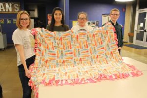 This group shows off a blanket with feather fabric.