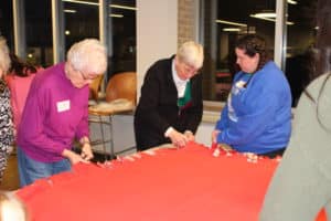 Sister Barbara Jean Head, left, and Sister Julia Head, center, are busy with their blanket making. Both are Brescia graduates. Sister Barbara Jean has been the senior accountant at Brescia since 2005.