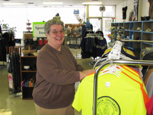 Sister Rose Jean sorts some T-shirts in the Brescia Bookstore.