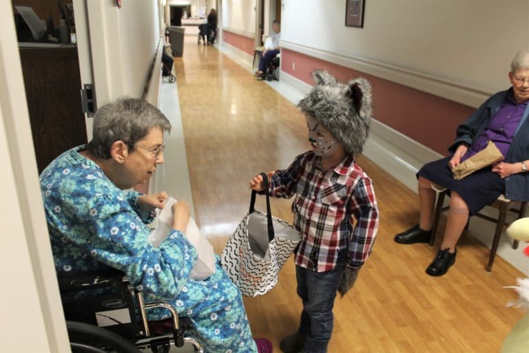 Sister Clarence Marie Luckett is not scared when a little wolf comes to her doorway. He is Emmitt, grandson of Jenny Lageson who works in Health Care in the Villa.