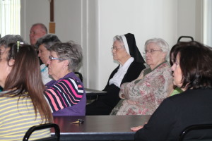 From left, Sister Betsy Moyer (striped shirt), Sister Joseph Angela Boone and Sister Eva Boone concentrate on the discussion.