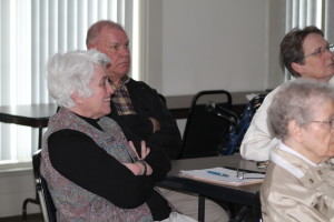 Ursuline Associates Marian Bennett, left, and Ed Cecil, both from Owensboro, enjoy the presentation. At right is Sister Amelia Stenger.