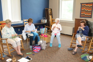 Left to right, Anne Presser, Hadley Harrington, Marilyn Baird and Moretta Bosley talk as they create their yarn projects.
