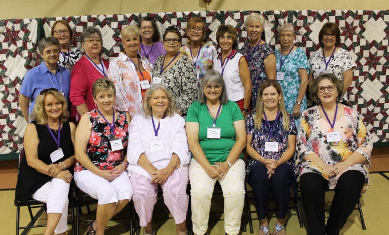 The class of 1972 is, seated from left, Bernadette Murphy Barnard, Rita Thomas Tanner, Lou Highland Goings, Patty Mattingly Arnett, Patricia Schwartz Cook and Mary Ann Clements Carr; standing from left are Sister Jacinta Powers, Dorothy Ford Riggs, Carolyn Thomas, Mary Ann Shewmaker Willett, Mary Carm O’Daniel Leonard, Sarah Kranz, Mary Karel Reedy, Shirley Bickett Warren, Susan Bickett Bachmann, Kay Beth Riney and Cathy Cecil Ebelhar.