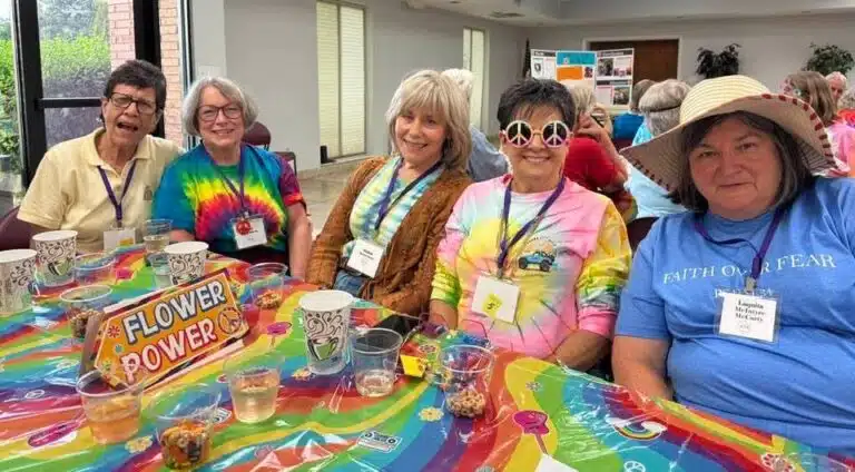 The Saturday night festivities at Our Lady of Lourdes Catholic Church parish hall were a tie-dyed splash of color for “Woodstock – Peace, Love and Unity.” Members of the class of 1974 got in the spirt of “flower power.” From left are Diane Bickett, Tina Weber Smith, Vickie Bickett Groce, Karen Calhoun McCarty, and Laquita McIntyre McCarty. The Saturday night festivities at Our Lady of Lourdes Catholic Church parish hall were a tie-dyed splash of color for “Woodstock – Peace, Love and Unity.” Members of the class of 1974 got in the spirt of “flower power.” From left are Diane Bickett, Tina Weber Smith, Vickie Bickett Groce, Karen Calhoun McCarty, and Laquita McIntyre McCarty.
