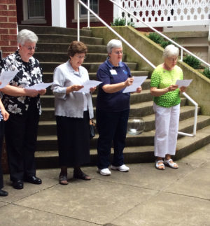 Sisters read the closing prayer during the ceremony. From left are Sisters Mary Timothy Bland, Margaret Ann Aull, Rita Scott and Angela Fitzpatrick.