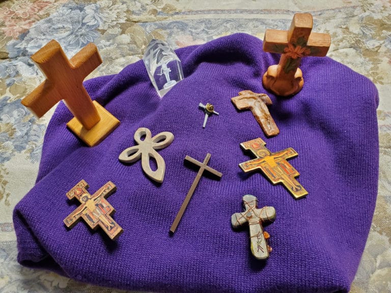 Sister Mary Matthias Ward shared the stories behind this collection of crosses: “One little cross on the bottom right was given to me by (the late) Sister Clara Reid when she came home from New Mexico. The tall wooden cross was made of “some special” St. Alphonsus wood and came from an older member of that parish. The crystal was given to me by Father Ray Goetz for my birthday last year. The pin is one we all got last Ash Wednesday during Lent. The other upright cross was given to me by the secretary of a retreat house in Louisville, Ky. There are two Franciscan crosses that probably came from a Franciscan brother. There is a stone cross from Kenya in the collection. The little black cross just popped into my life one day. I never remember that I have these until Lent, and I gather them on my prayer table.”